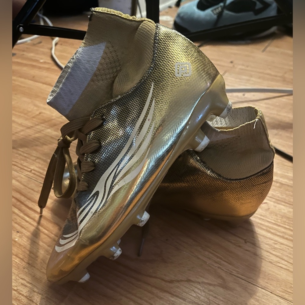 Gold cleats for football or soccer